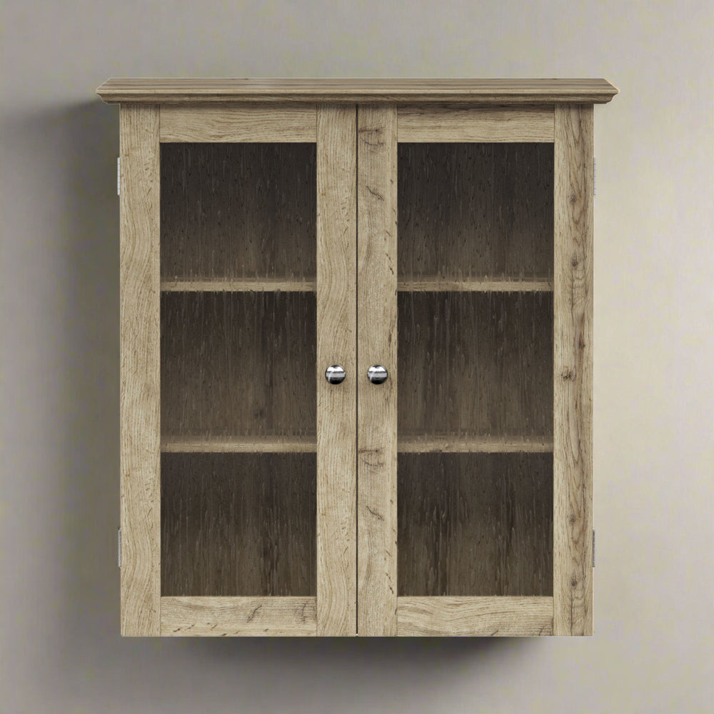 Light oak finished wall cabinet with two glass paneled door hanging on a tan wall.