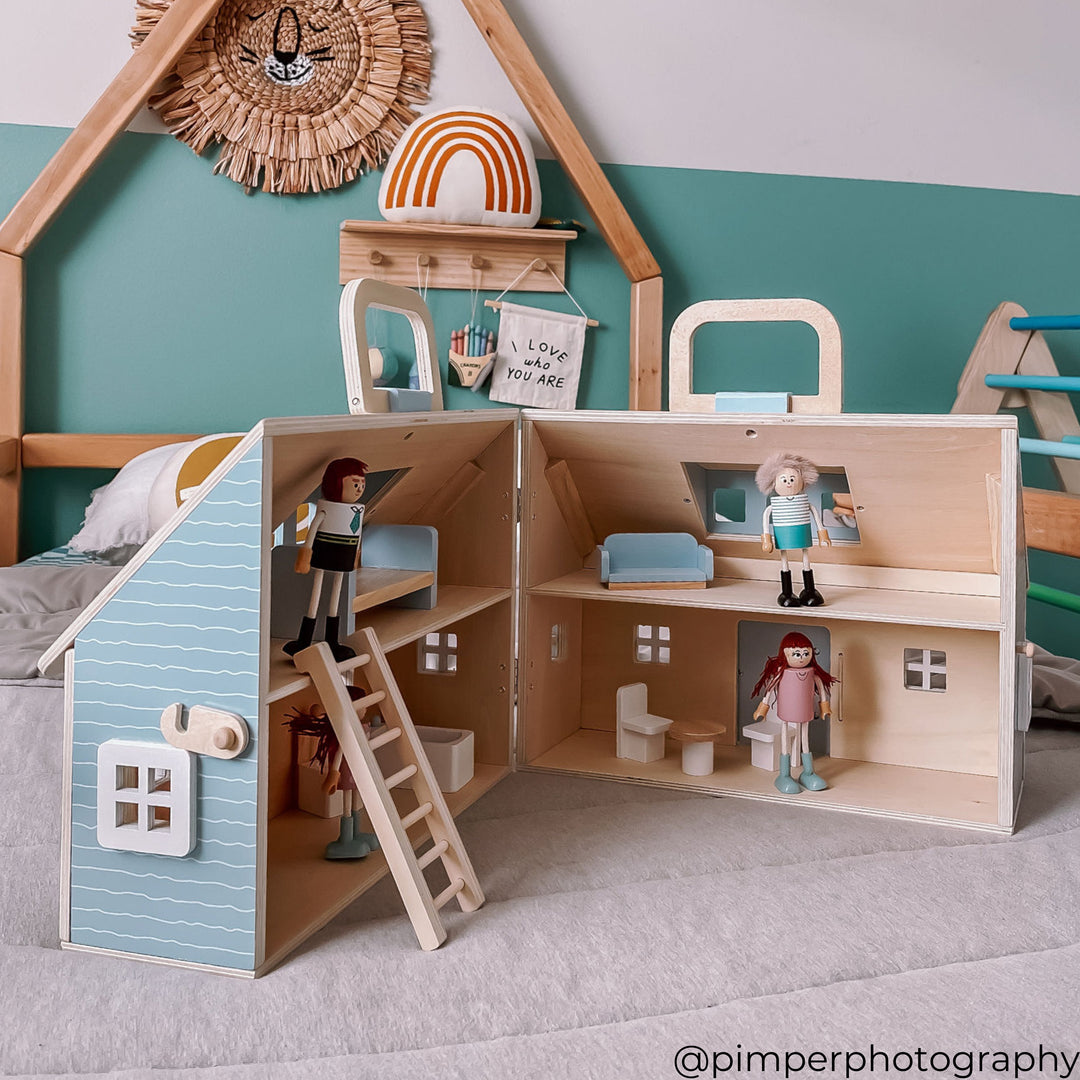 A wooden cottage with four 3.5" figurines and furnishings