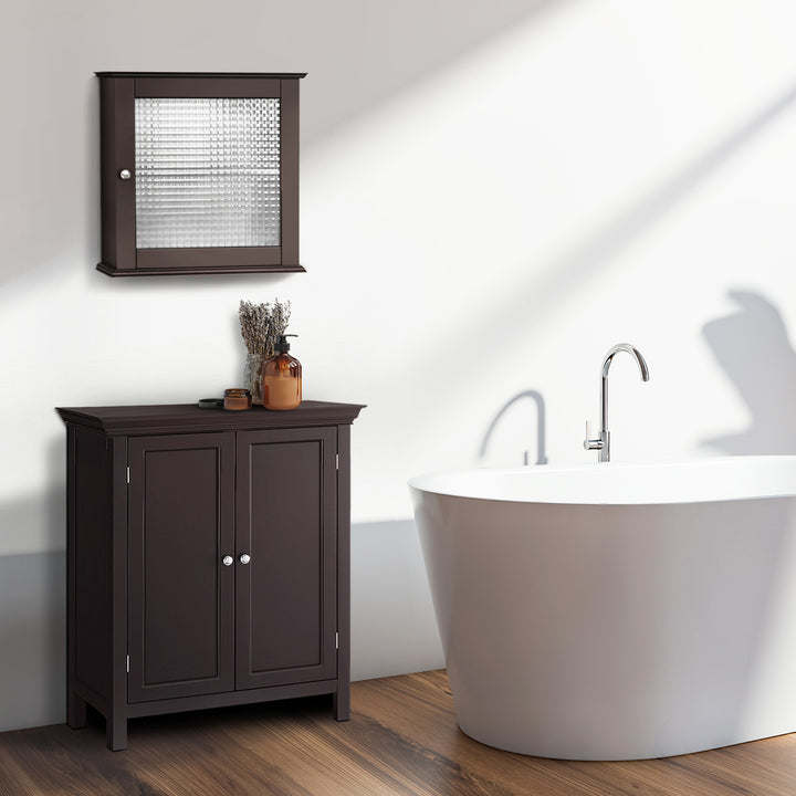 A dark espresso medicine cabinet with a waffle glass paneled door above a floor cabinet next to a white bathtub