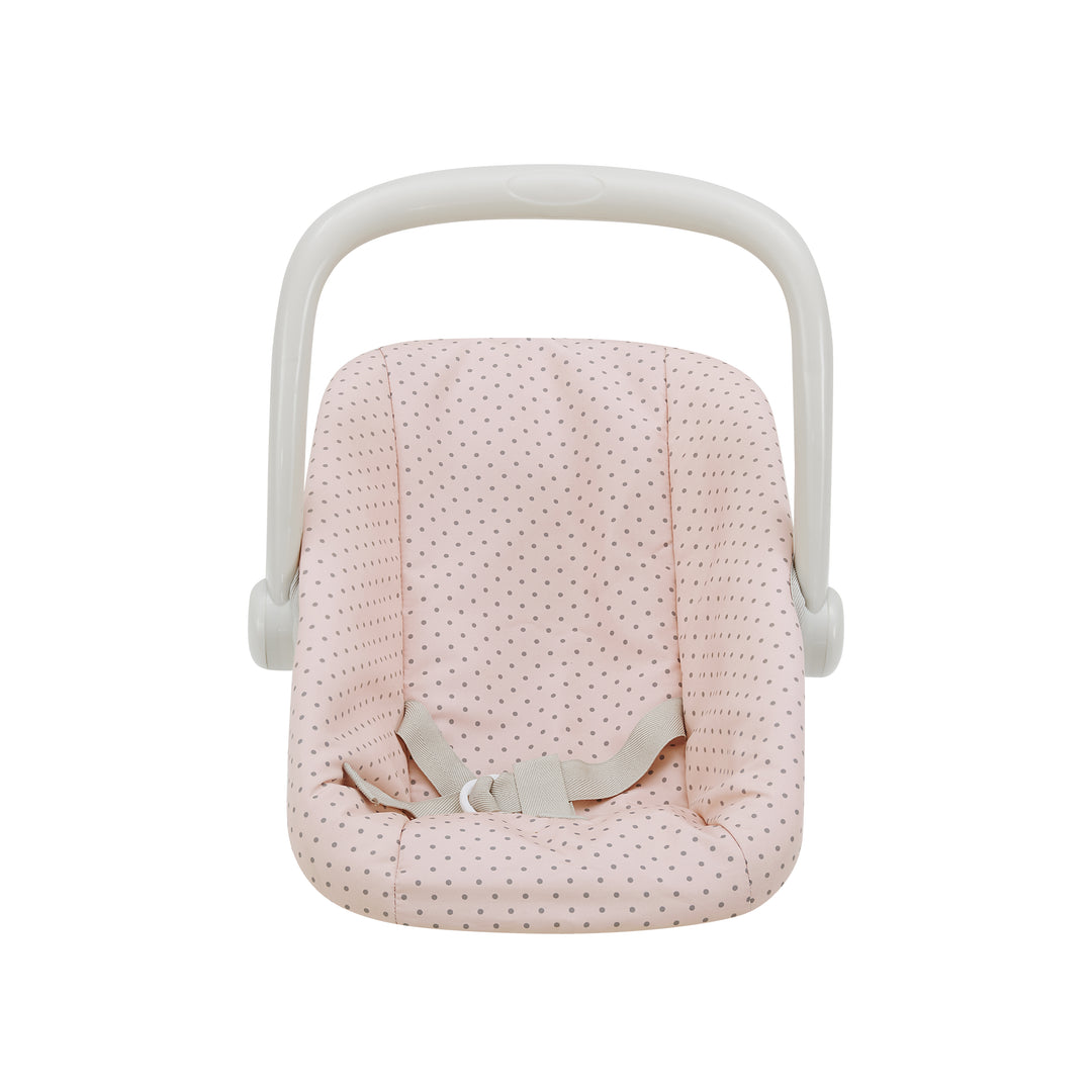 a child's pretend infant car seat in pink with gray polka dots