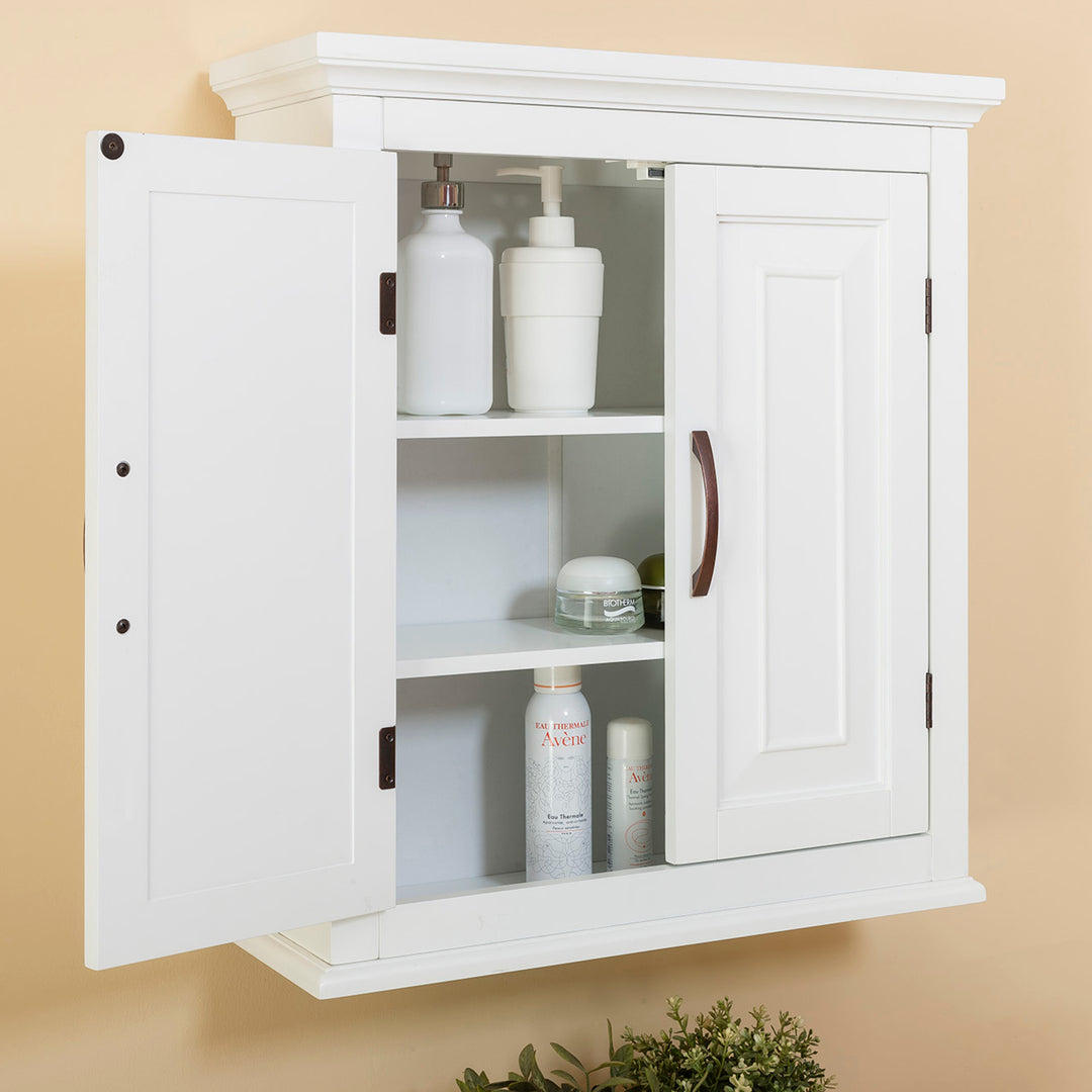 A white wall cabinet with the door open with items on the shelves