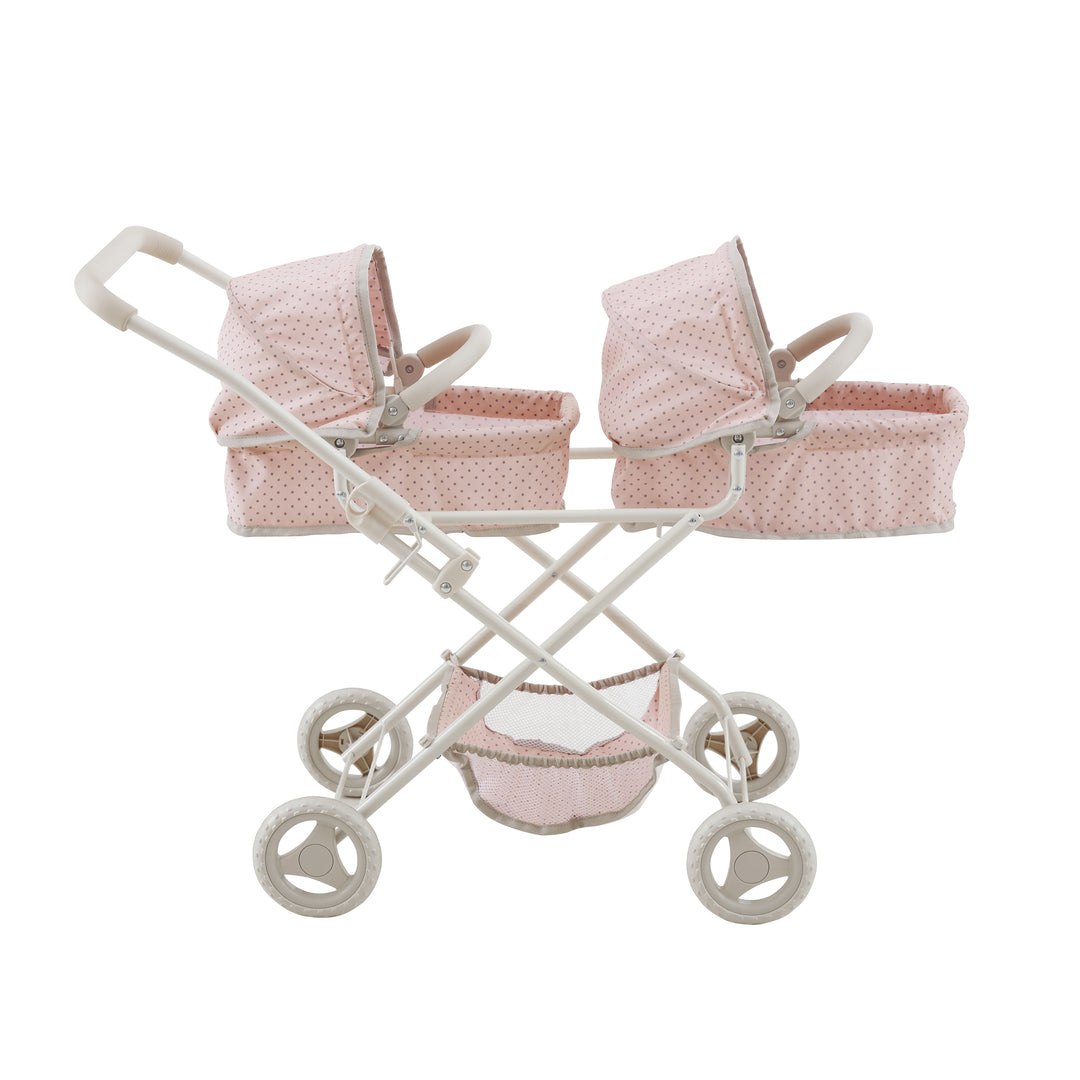 Side view of a double bassinet stroller, pink with gray polka-dotted material and white framework