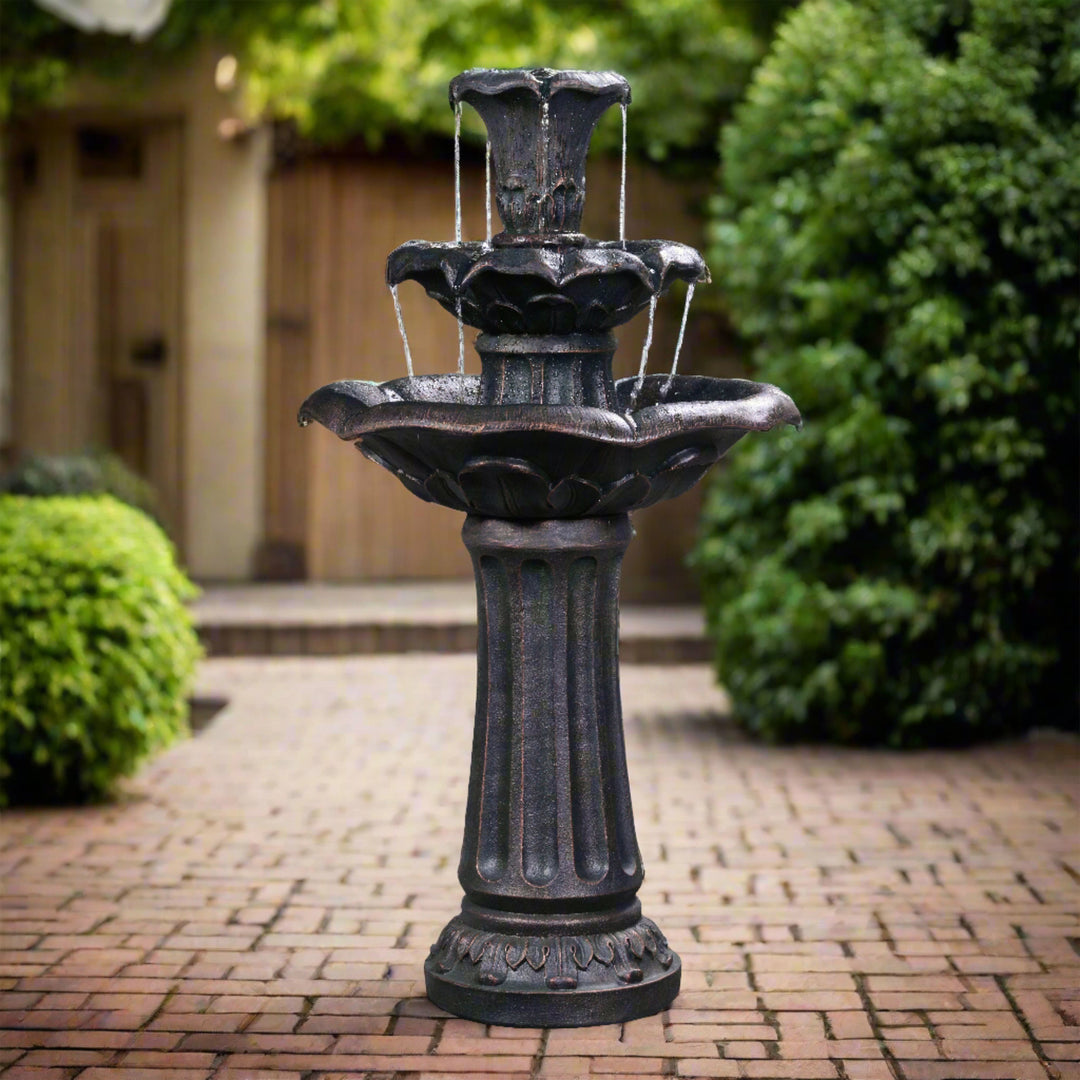 Lily fountain in the center of a courtyard with plants