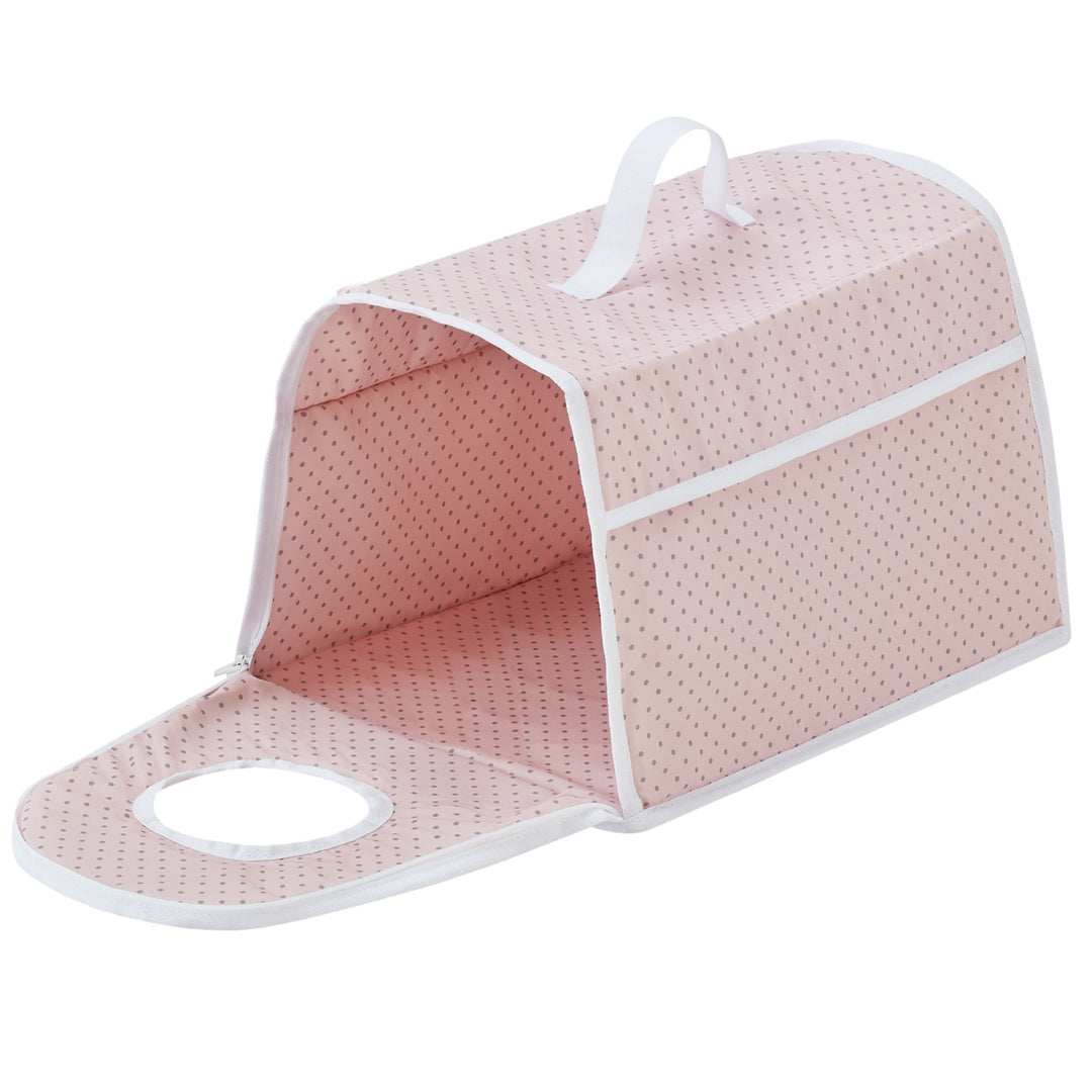 A pink and white polka-dotted fabric pet carrier with a handle, side zipper, and circular viewing hole. The carrier is unzipped and open.
