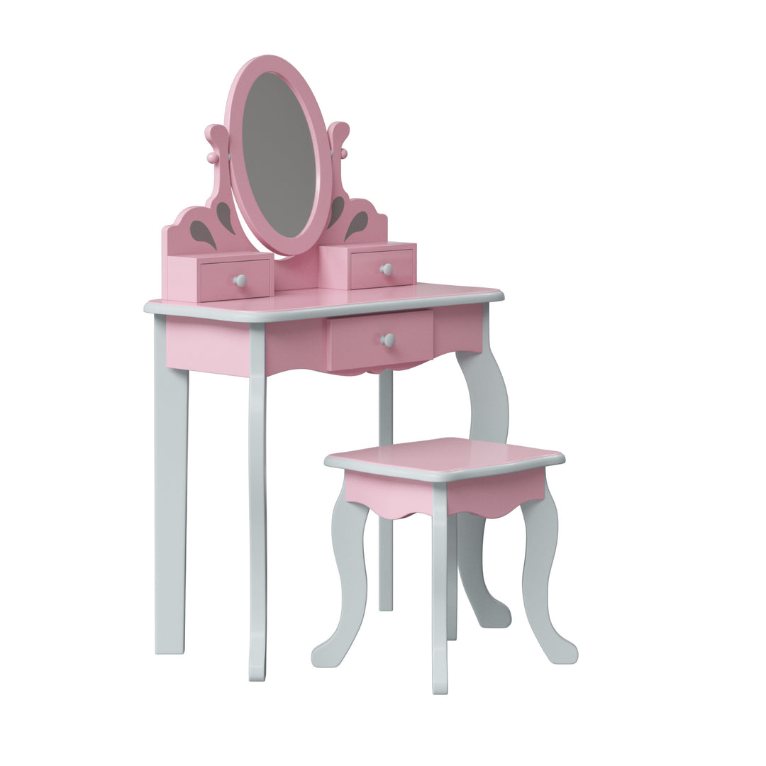 A side view of a pink and gray vanity set with an oval mirror and three drawers