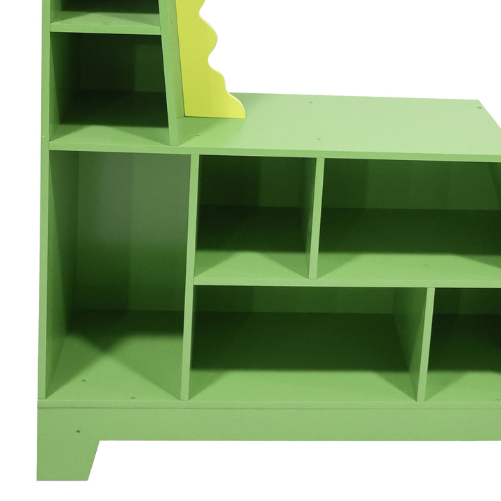 A close-up of the different sized compartments inside the dinosaur-shaped bookshelf