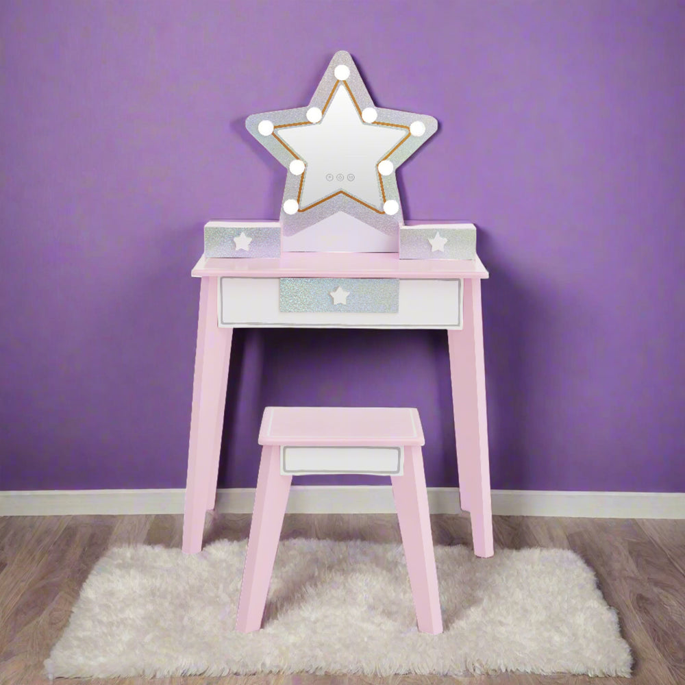 a star shaped vanity in pink and glittery silver with led lights is shown in a girls bedroom