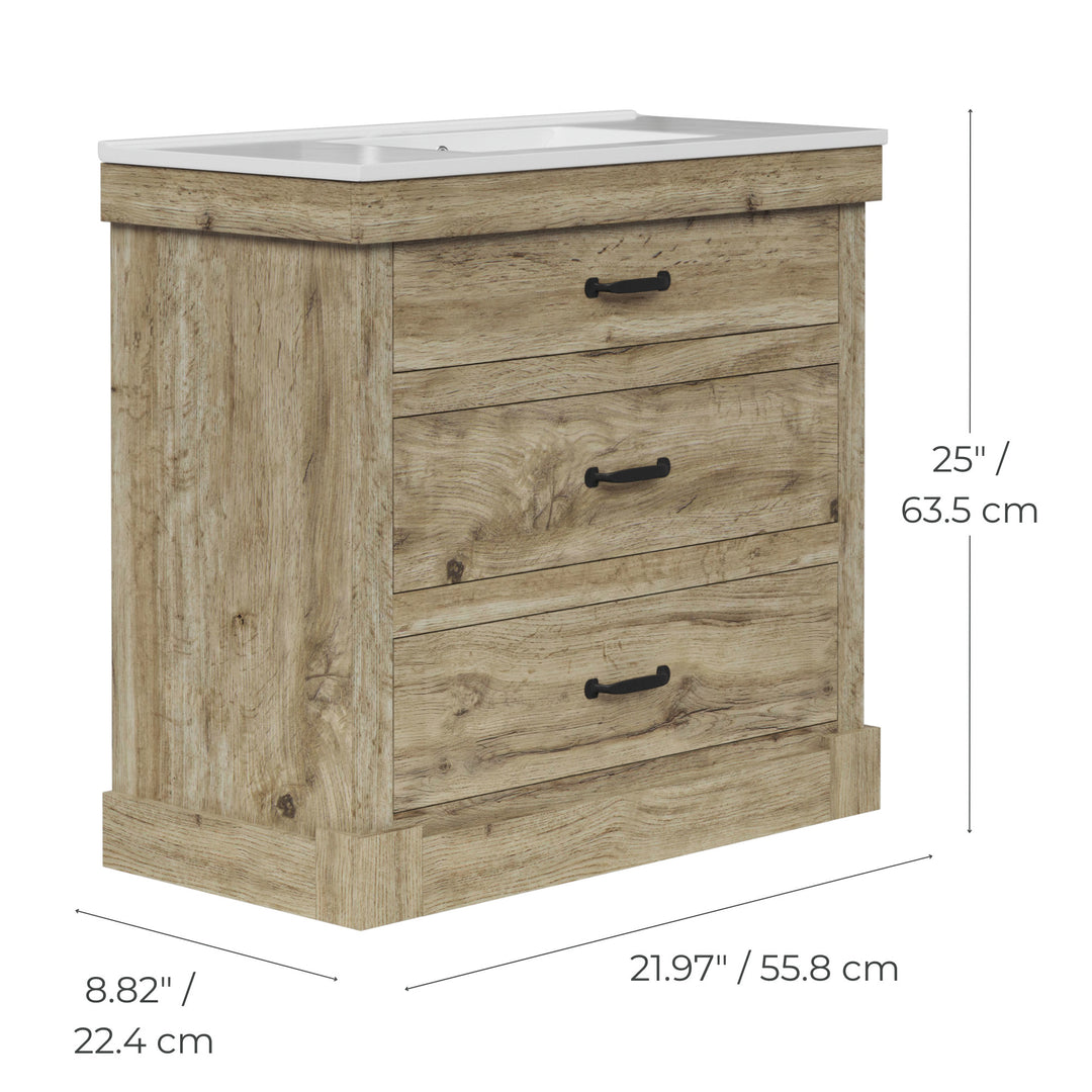 Dimensional graphic of a light oak finished sink vanity in inches and centimeters.