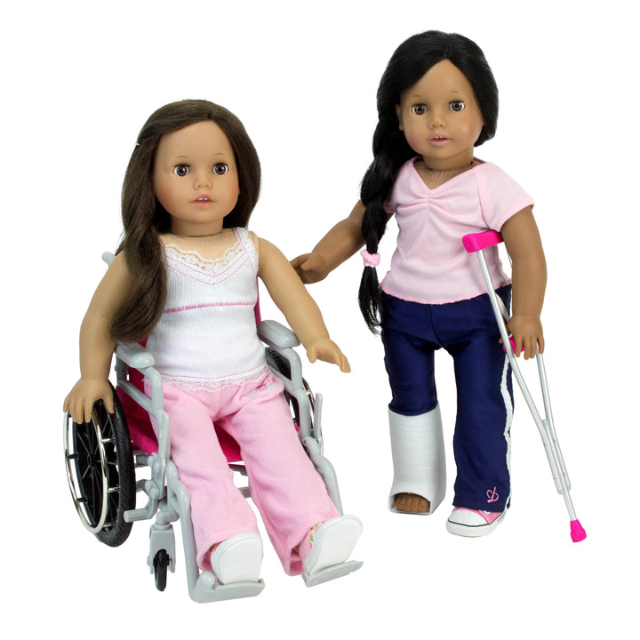 Two brunette 18" dolls - one in a wheelchair and one supported by a crutch