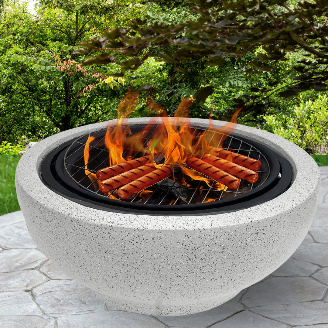 Fire pit with hot dogs grilling.