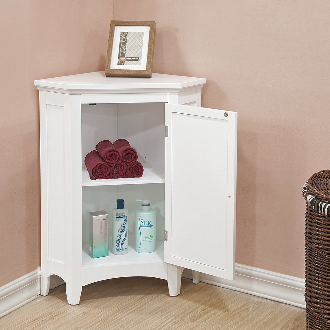 A white corner floor cabinet with the door open and items stored inside