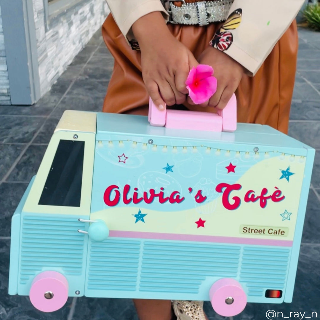 A food truck playset wth a pink handle