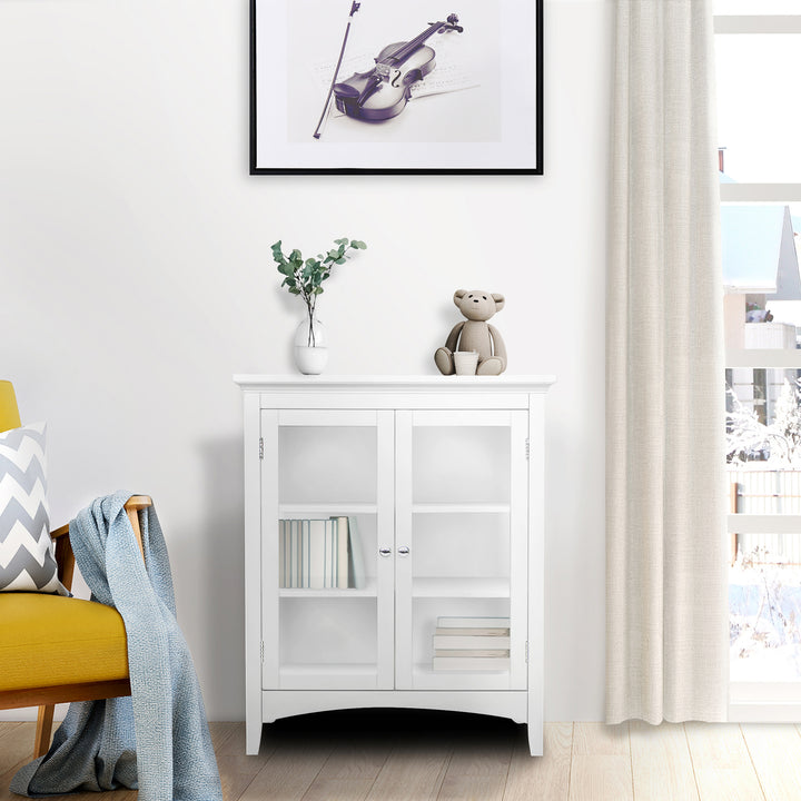 A white wall cabinet with glass paneled doors and two interior shelves