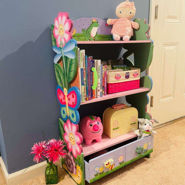 A view of a 3-tier bookshelf with toys and books on the shelves