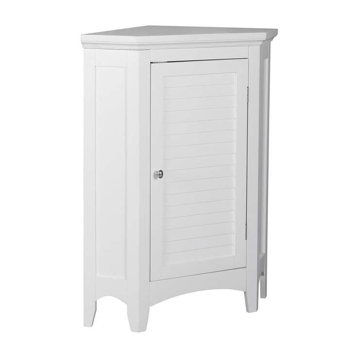 Side view of a white corner floor cabinet with a faux louvered door