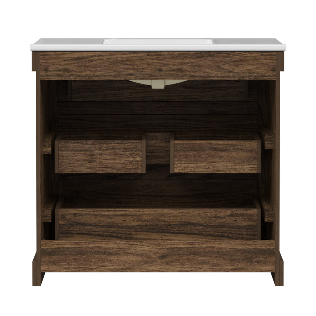 Back view of a walnut finished sink vanity with three drawers, including a middle drawer shaped to accommodate plumbing.