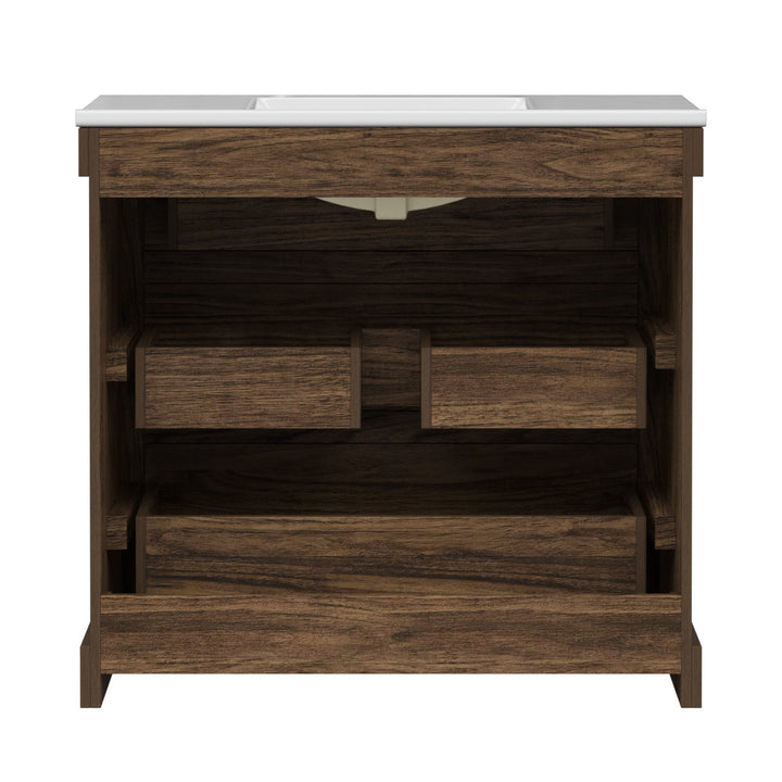 Back view of a walnut finished sink vanity with three drawers, including a middle drawer shaped to accommodate plumbing.