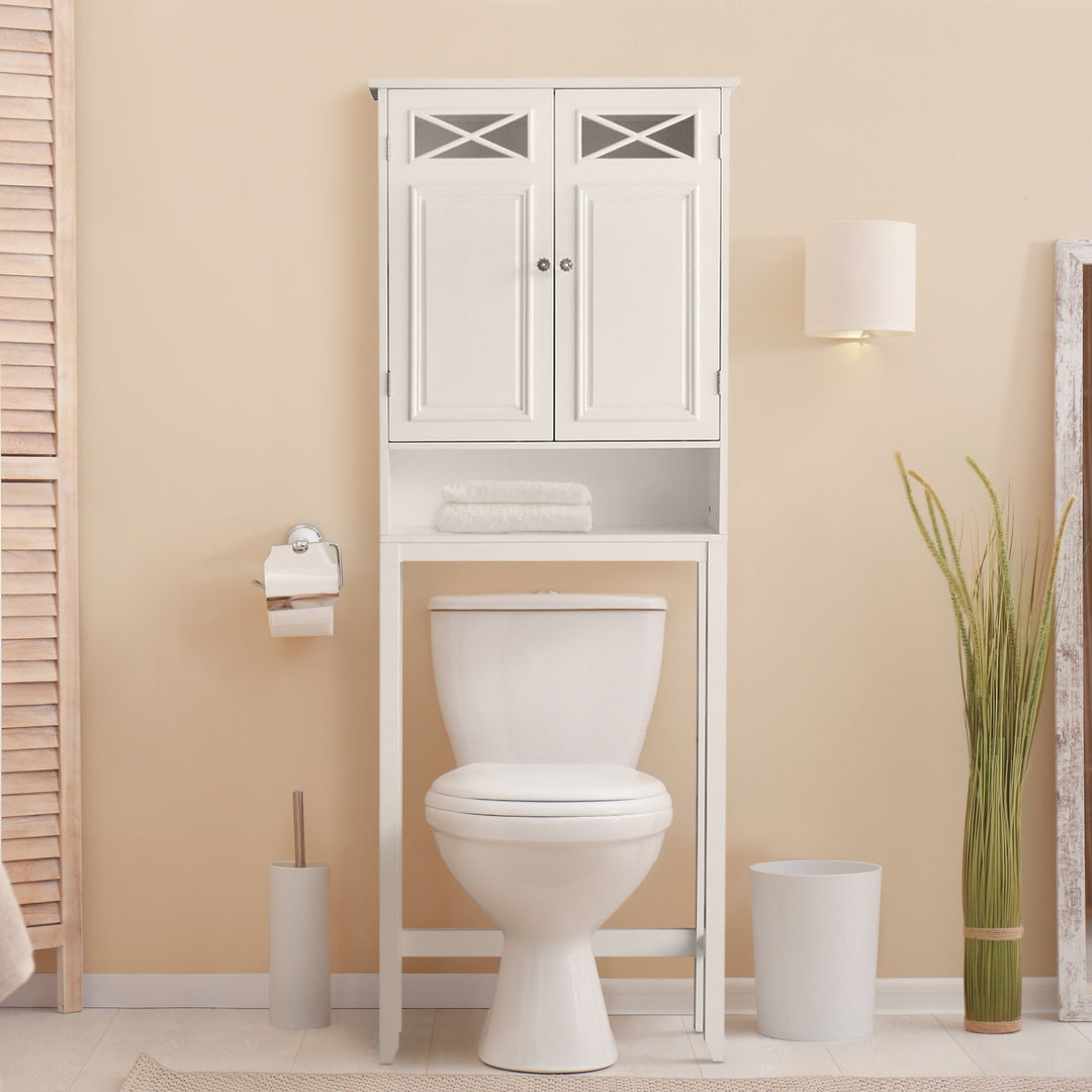 A white over-the-toilet cabinet in a bathroom over a toilet