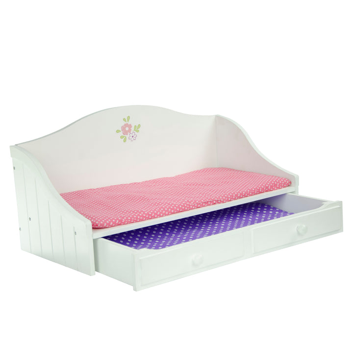 The daybed with underneath trundle pulled out, both featuring bedding.