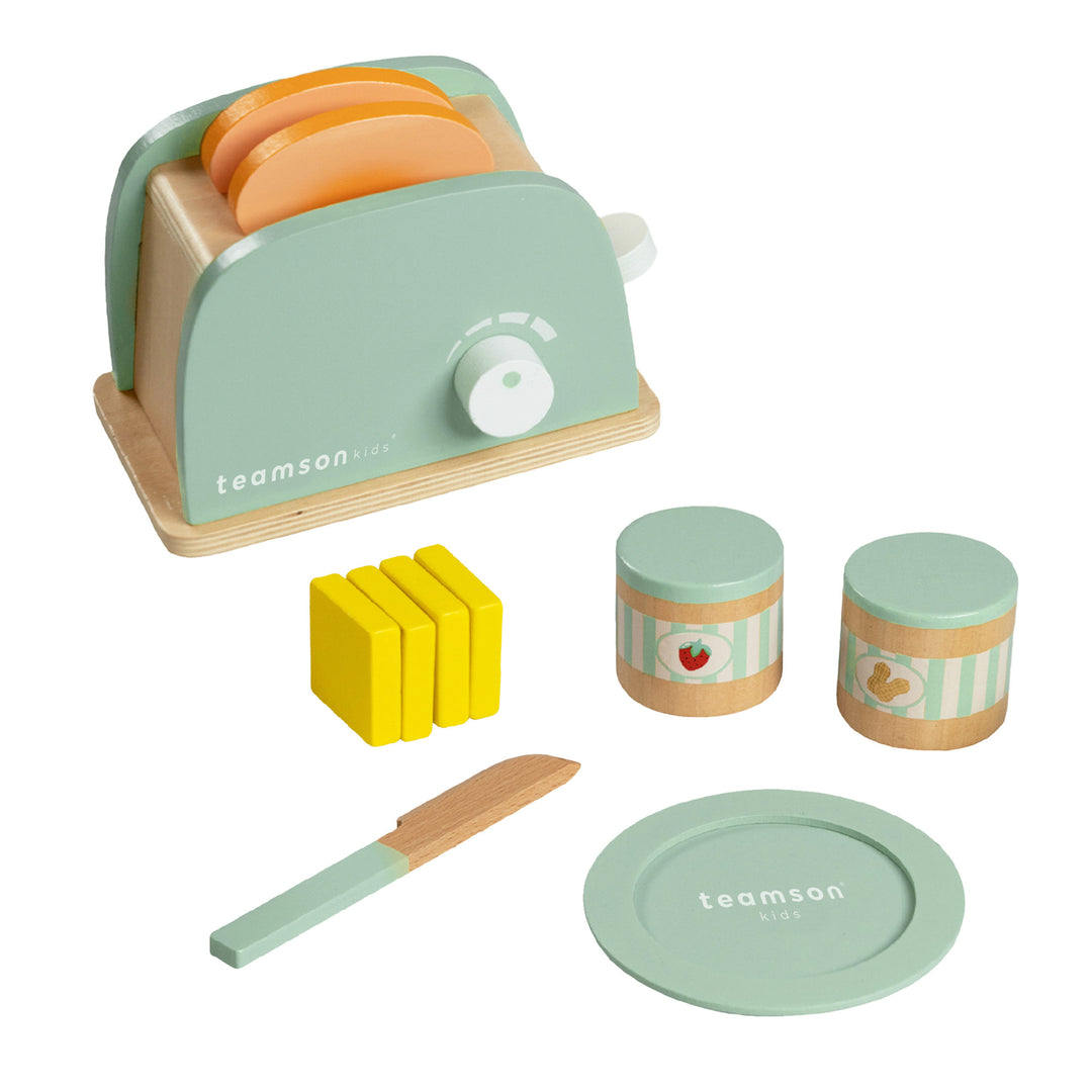 A play toaster with pretend bread, butter pats, knife, jars of spread and a plate