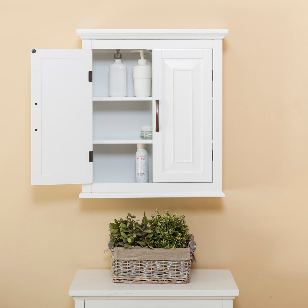 A white wall cabinet with a door open with two shelves