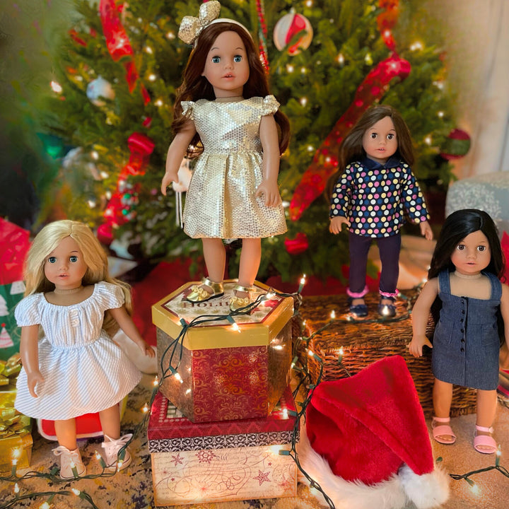 4 18" dolls - blonde with gingham dress, auburn hair with sparkly dress, brunette with a polka dot top and navy leggings, black hair with a denim dress