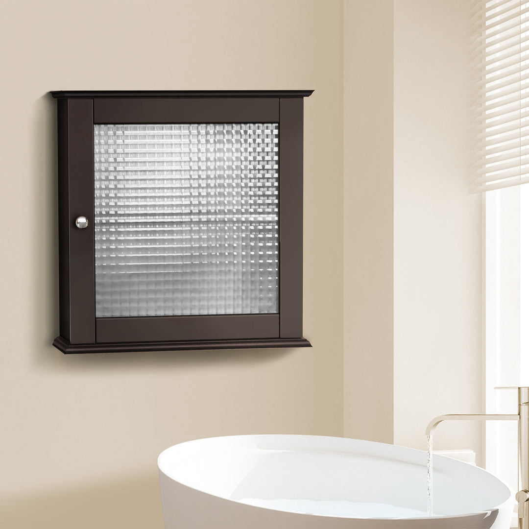 A dark espresso medicine cabinet with a waffle glass paneled door hanging next to a sink