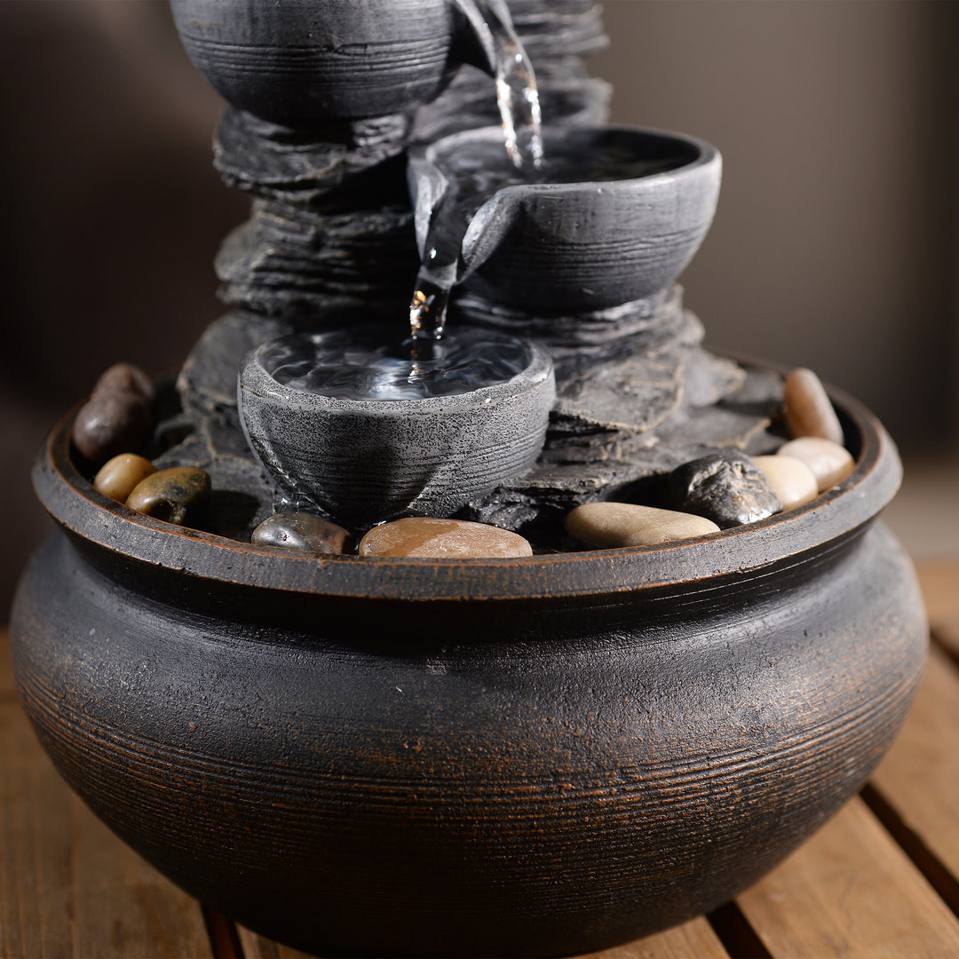 Closeup of the staggered levels of a tabletop water fountain