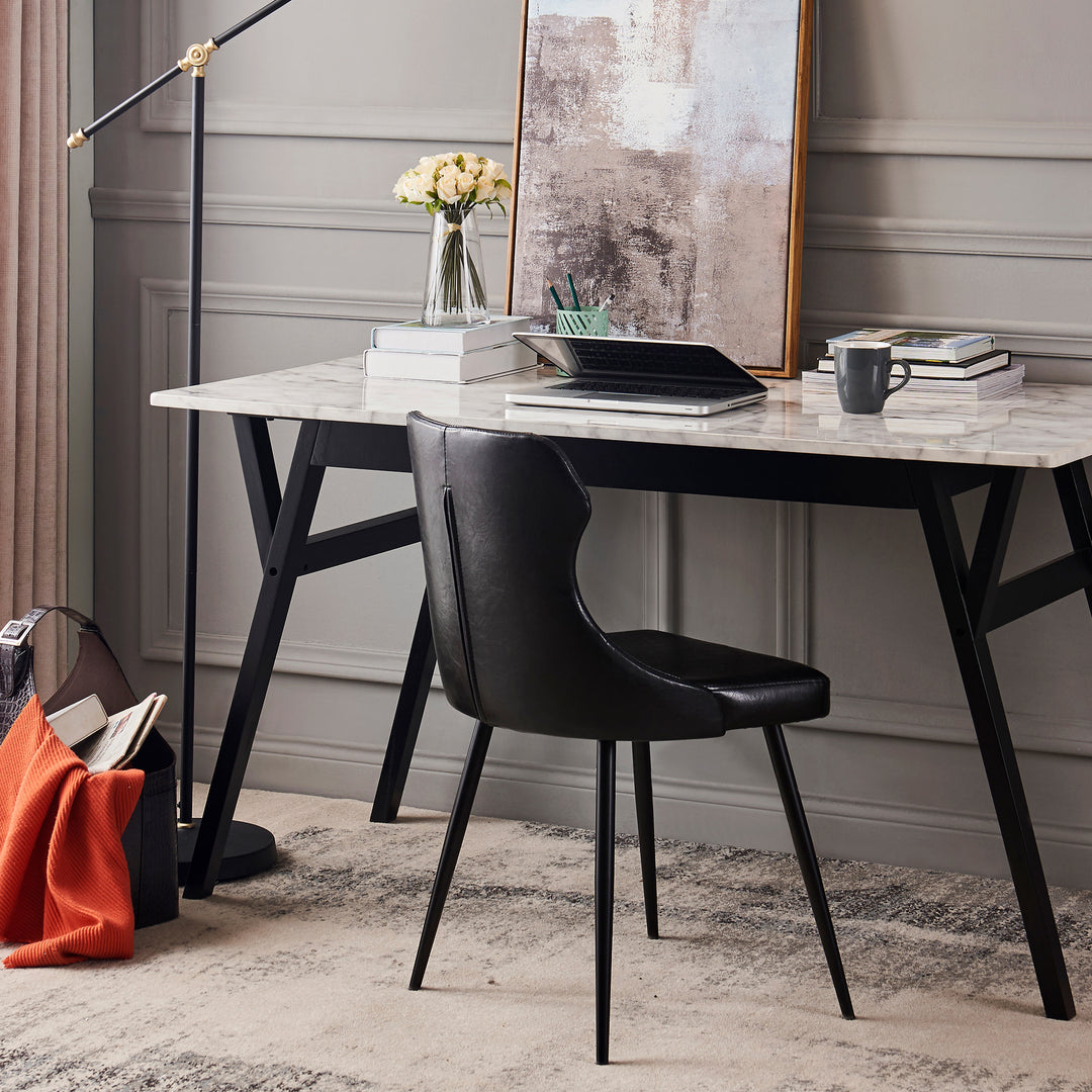 Lifestyle of black chair at a faux marble desk in an office space.