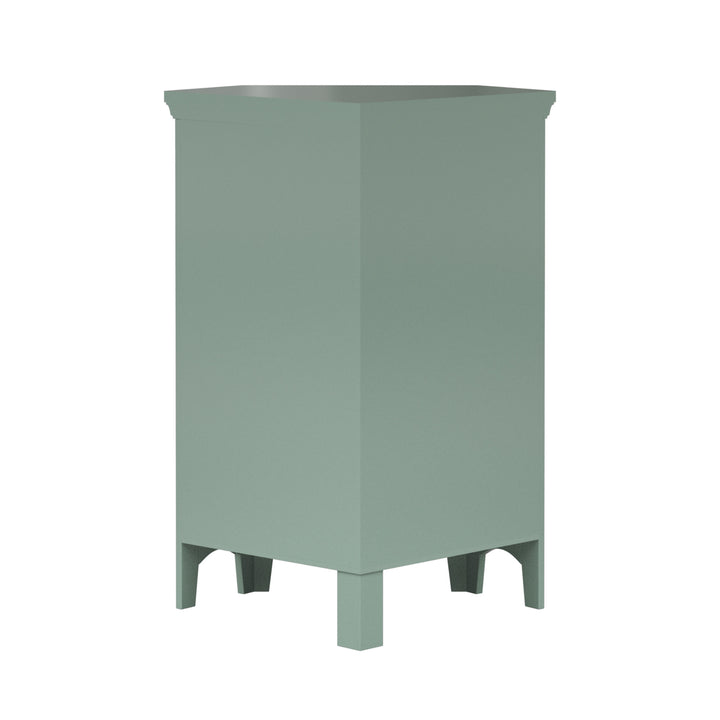 A back view of a sage green corner floor cabinet.