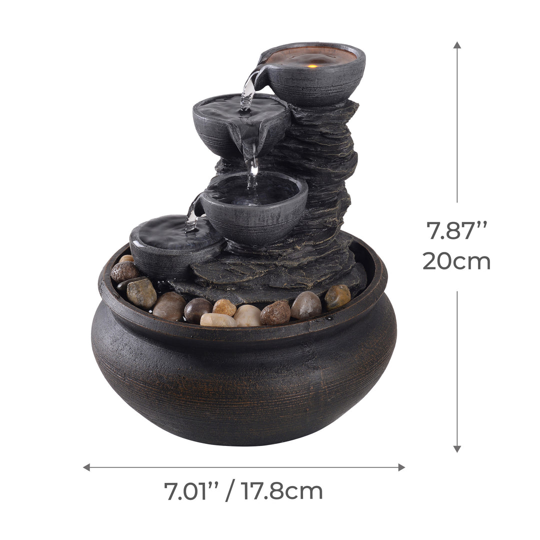 Dimensional graphic of a tabletop water fountain in inches and centimeters