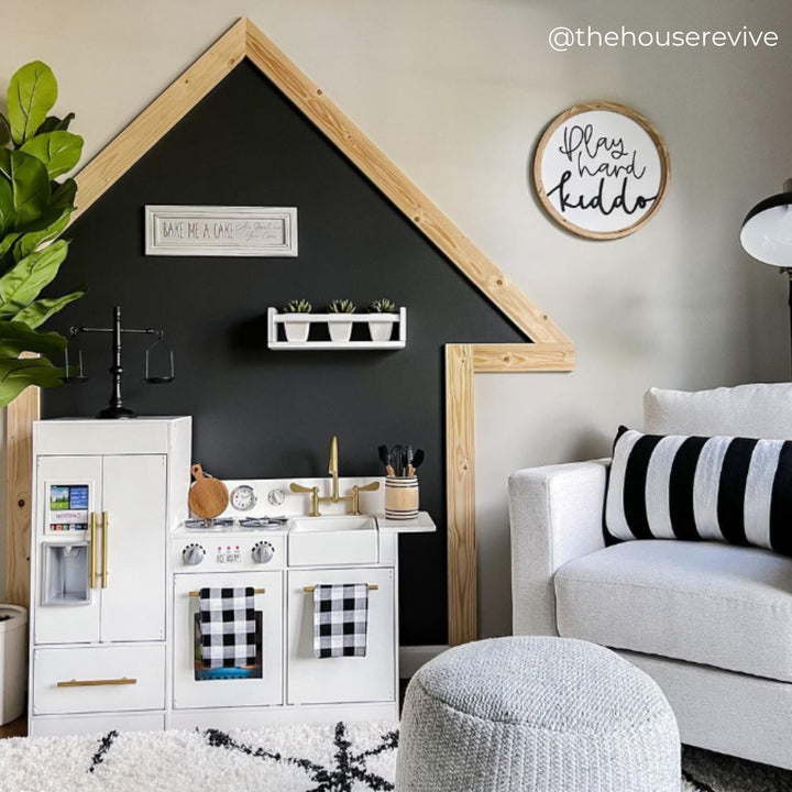 A modern style play kitchen in a stylish playroom