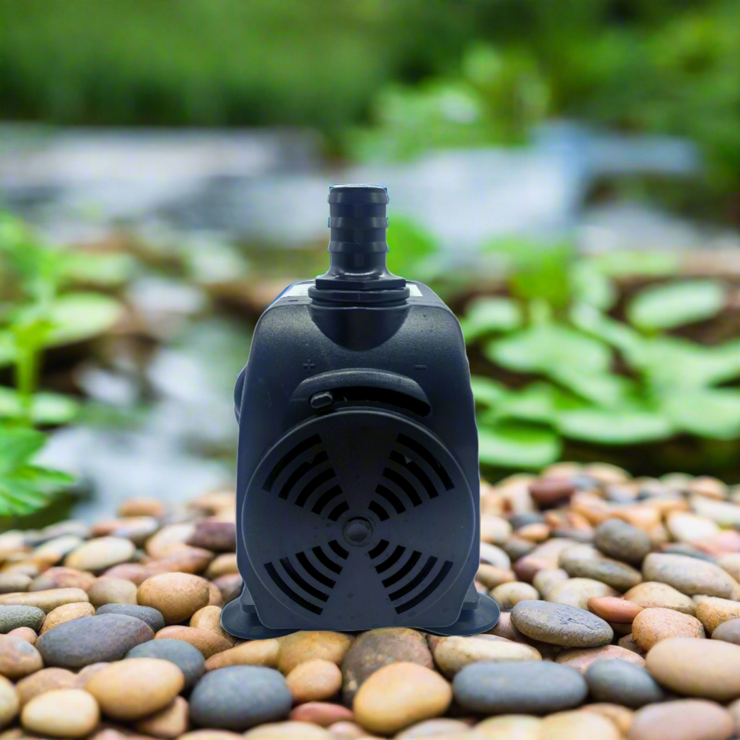 pump on rocks next to pond