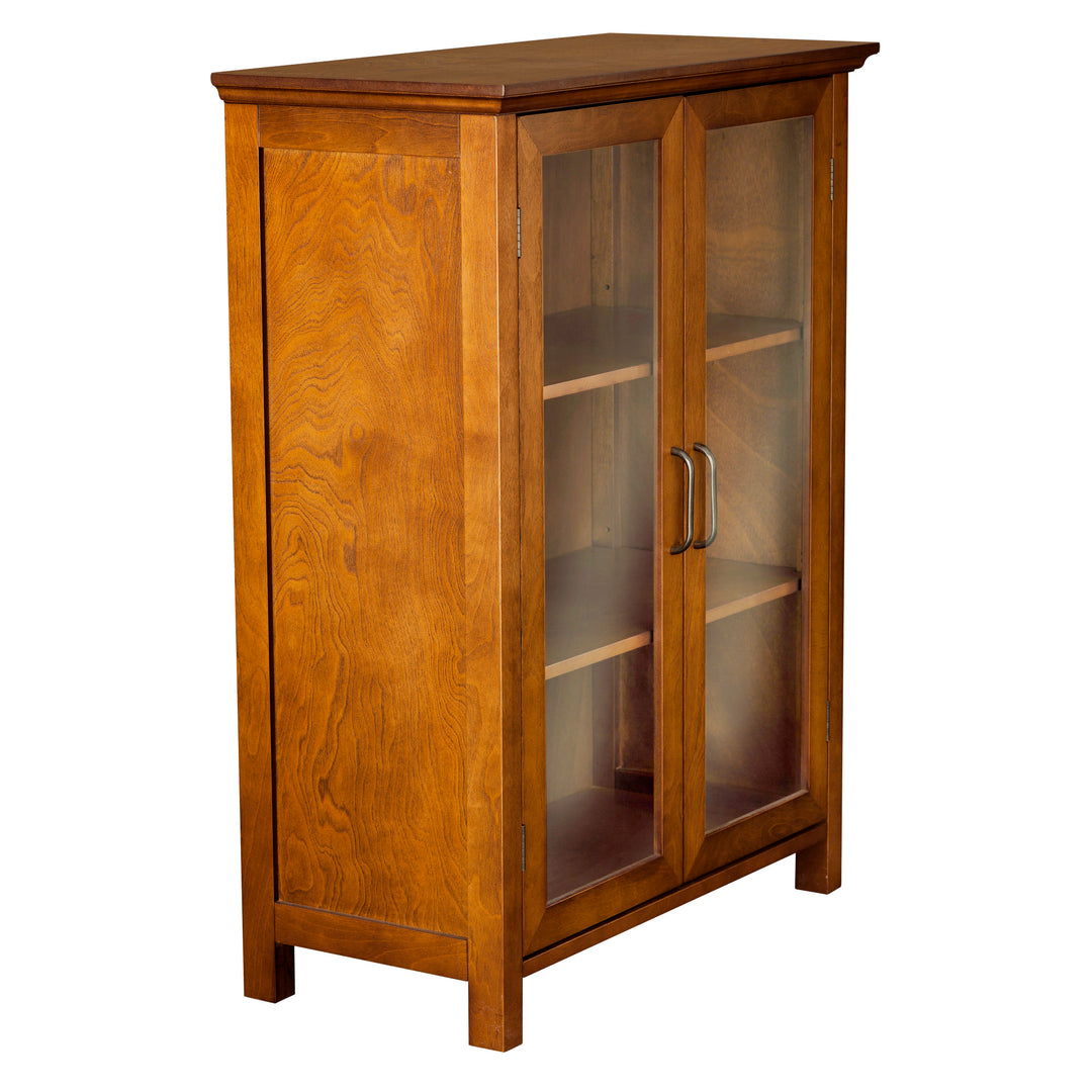 Sideview of a glass-paneled door floor cabinet with two adjustable shelves