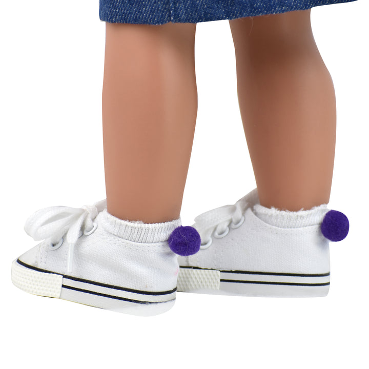 A pair of white footie socks with a purple pom pom on the back