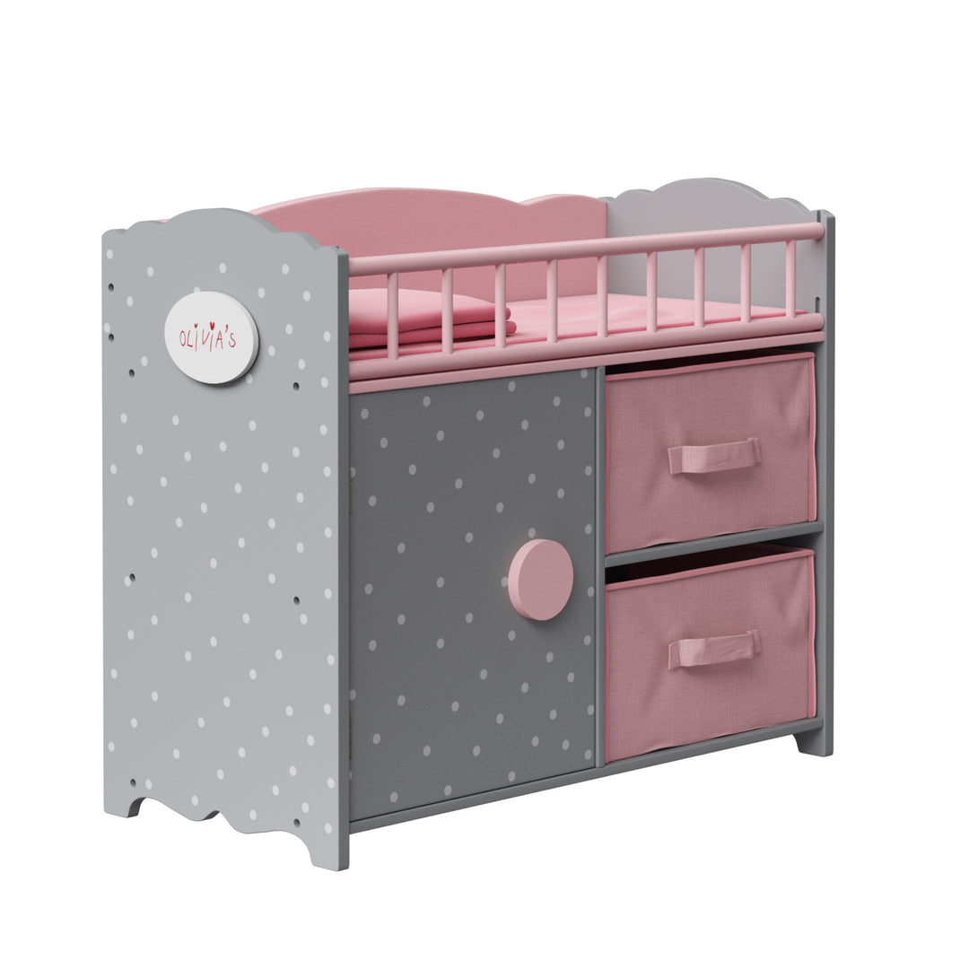 A sideview of a gray and pink baby doll changing table with pink bins