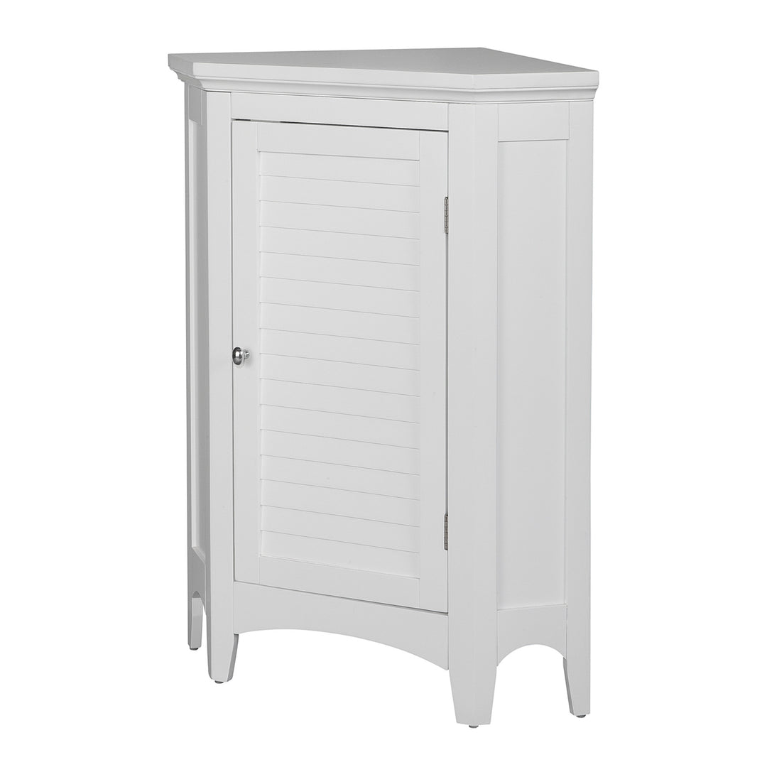 Side view of a white corner floor cabinet with a faux louvered door