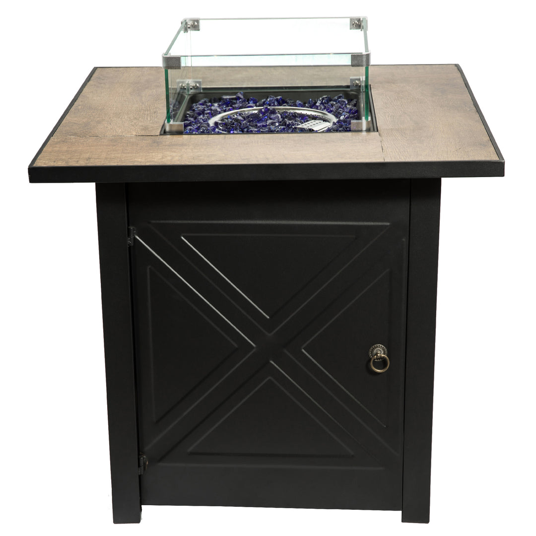 Black propane gas fire pit table with tile border and blue lava glass