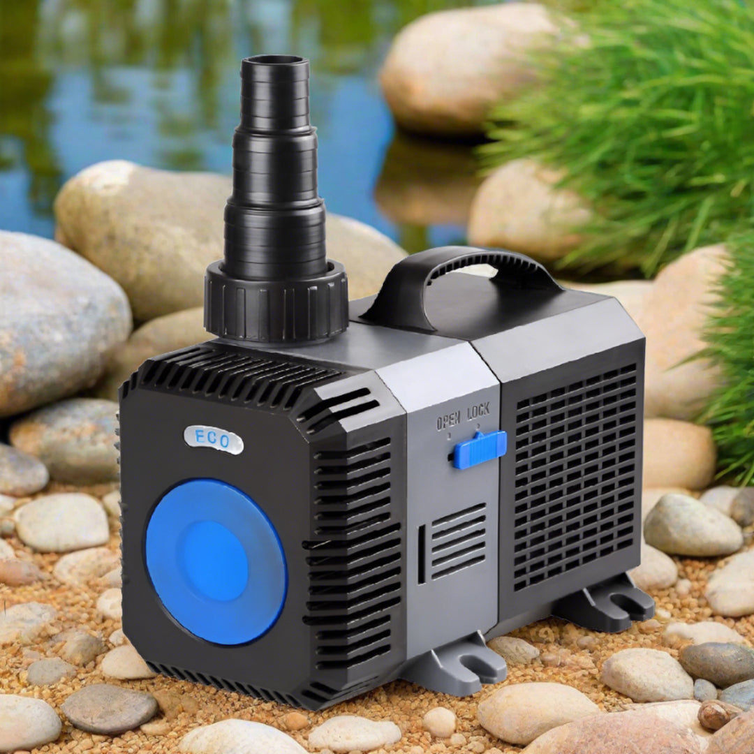 lifestyle image of the pump sitting on rocks next to a pond