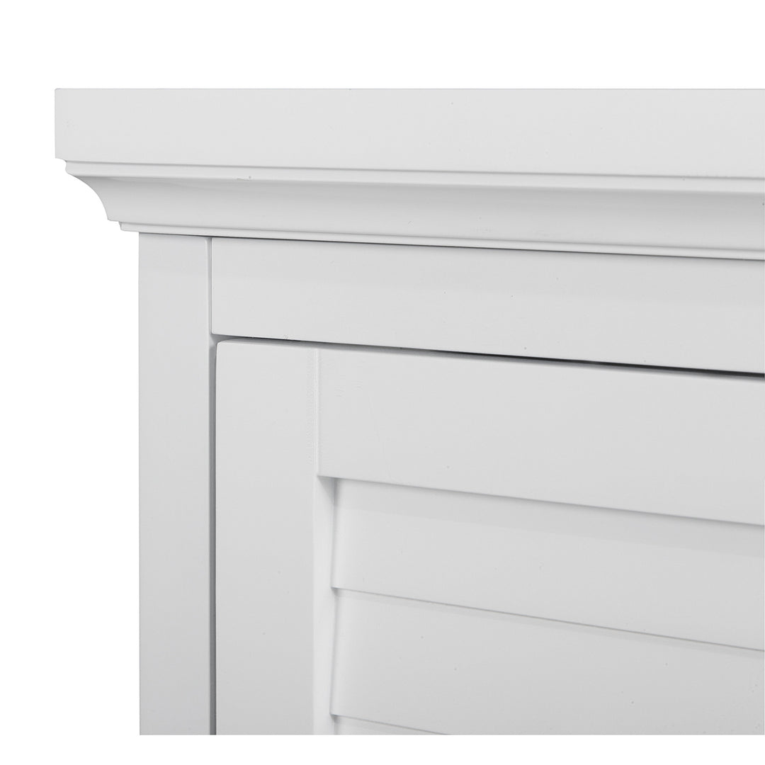 A close-up of the top of the Teamson Home White Glancy Corner Wall Cabinet with Louvered Door