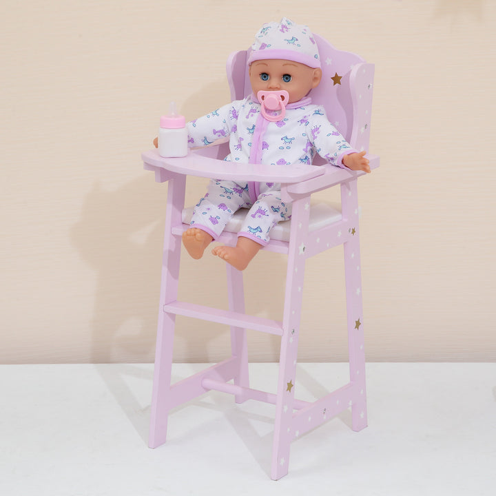 A baby doll sitting in a baby doll highchair. purple with white and gold stars.