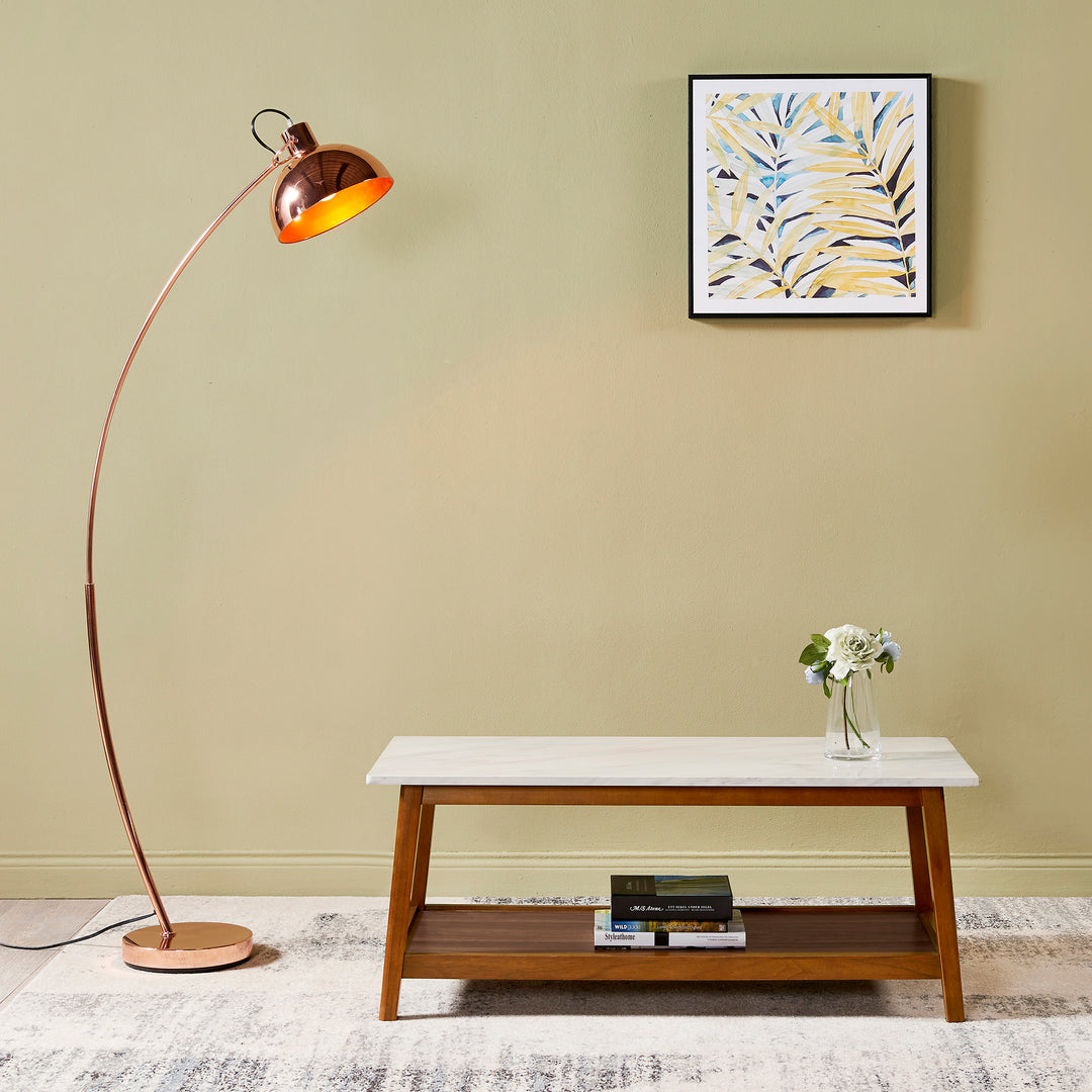 A room with a Teamson Home Kingston Wooden Coffee Table with Storage and Marble-Look Top, Marble/Walnut featuring a durable structure and a floor lamp.