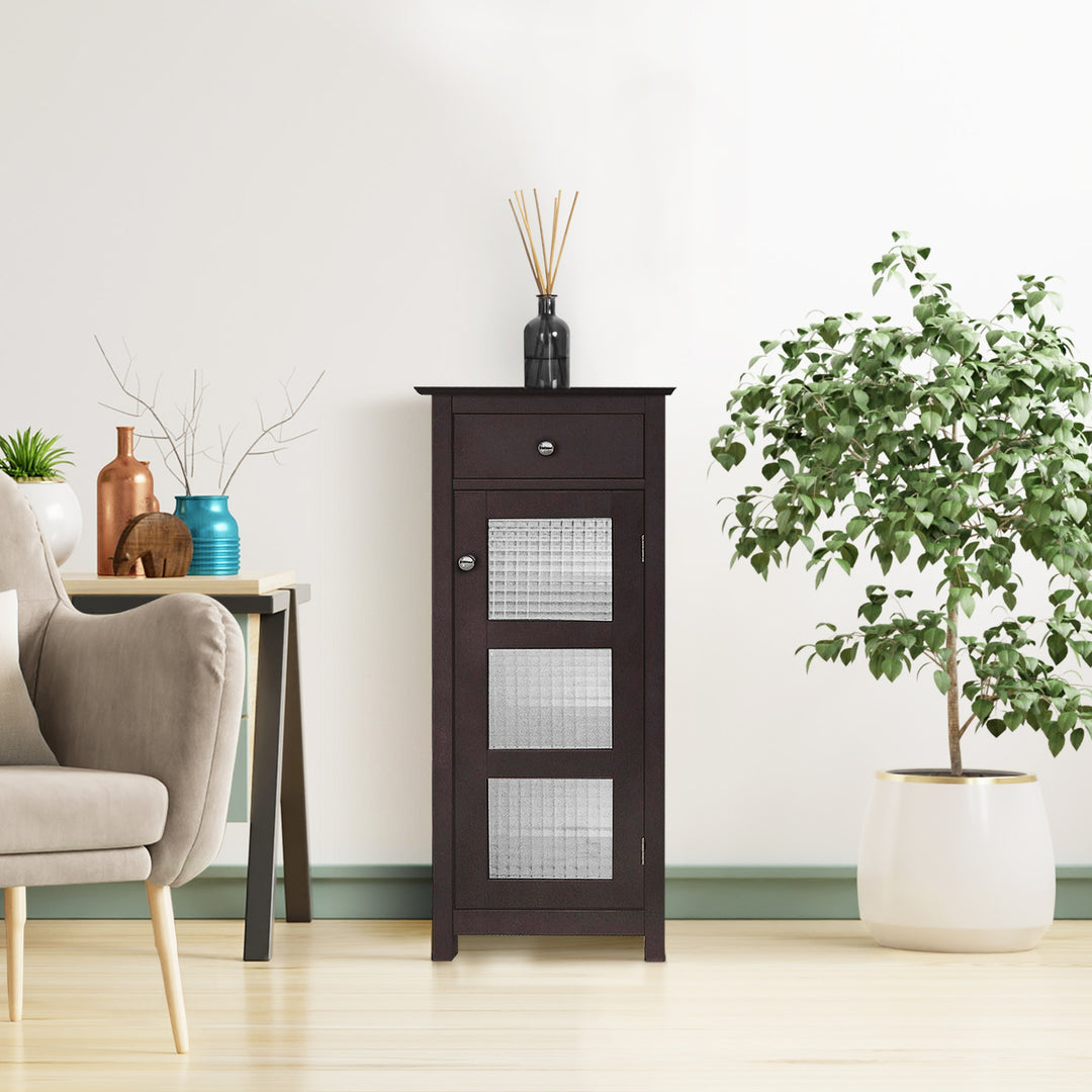 Teamson Home Chesterfield Wooden Floor Cabinet with Storage Drawer and Waffle Glass Door, Espresso in a room with a plant and a chair.