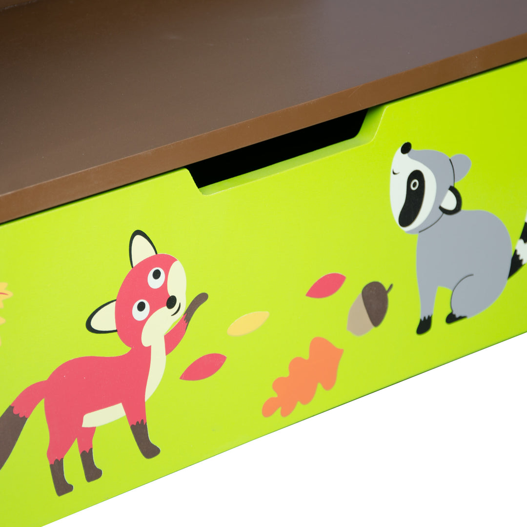 Close-up of a storage drawer front with a fox and racoon on a child's bookshelf