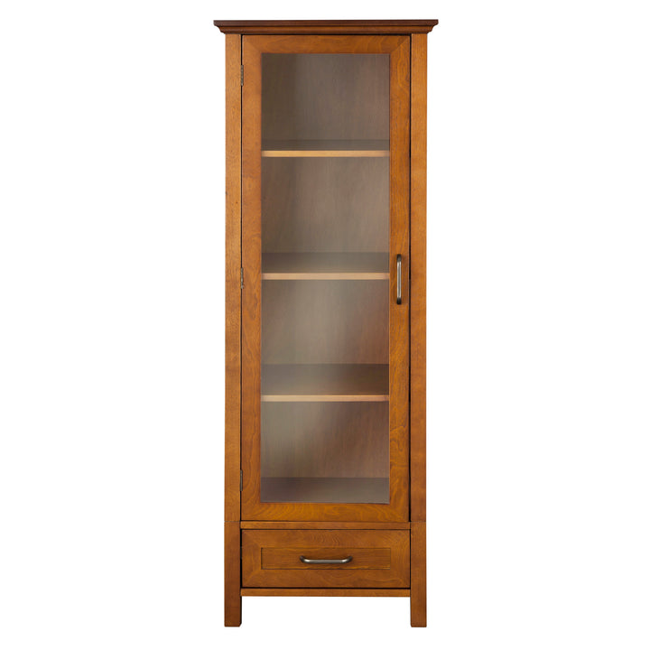 Teamson Home Avery Wooden Linen Tower Cabinet with Storage, Oiled Oak with a glass door and a lower drawer.