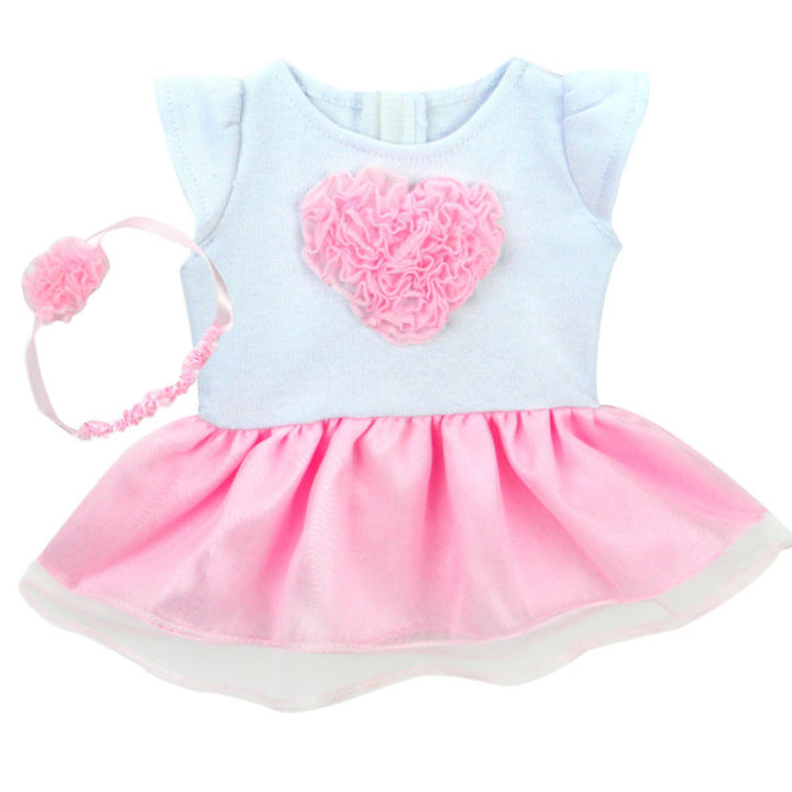 A white capped sleeved dress with a pink tulle heart and skirt and matching headband.