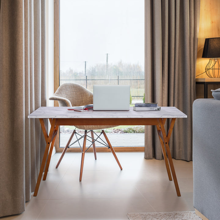 Teamson Home Ashton Dining Table with Natural Wood Base and Faux Marble Tabletop in front of a big windee.