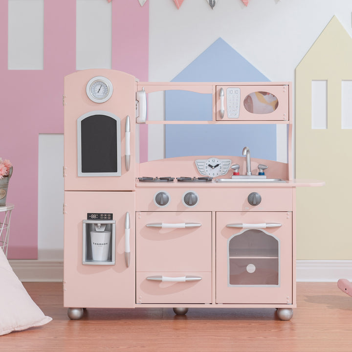 Retro style pink play kitchen in a playroom