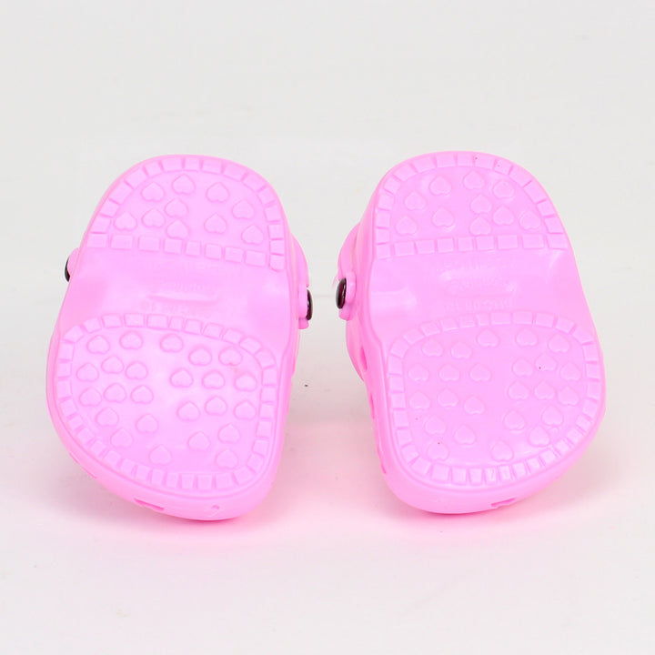 A pair of pink garden clogs for an 18" doll.