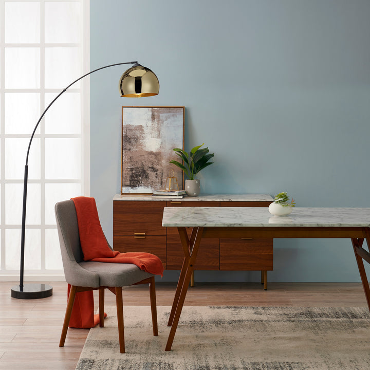 A dining room with a Teamson Home Ashton Rectangular Marble-Look Dining Table with Wood Base and durable chairs.